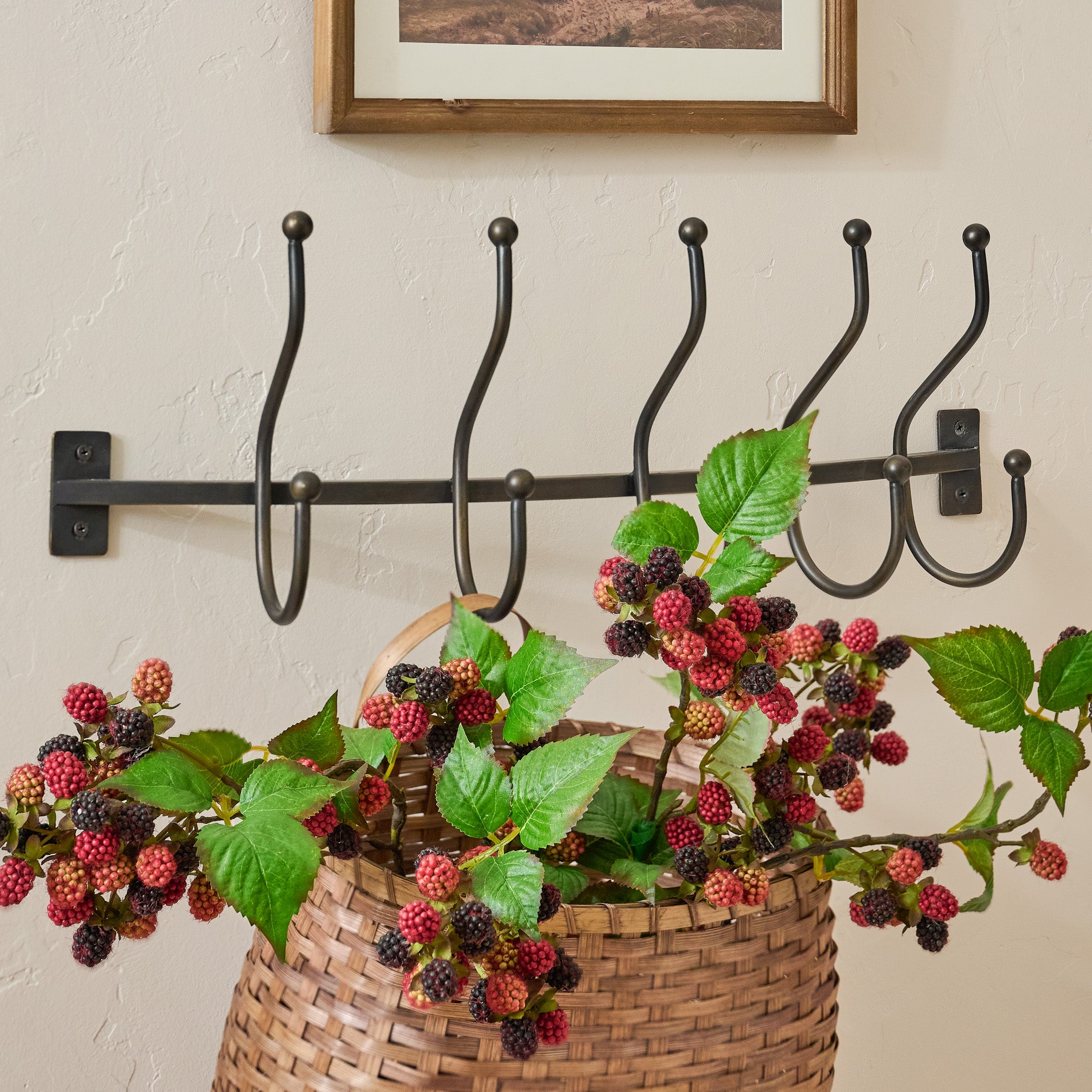 Webster Antique Bronze Hook Rack shown styled with wall basket and seasonal branches $58.00