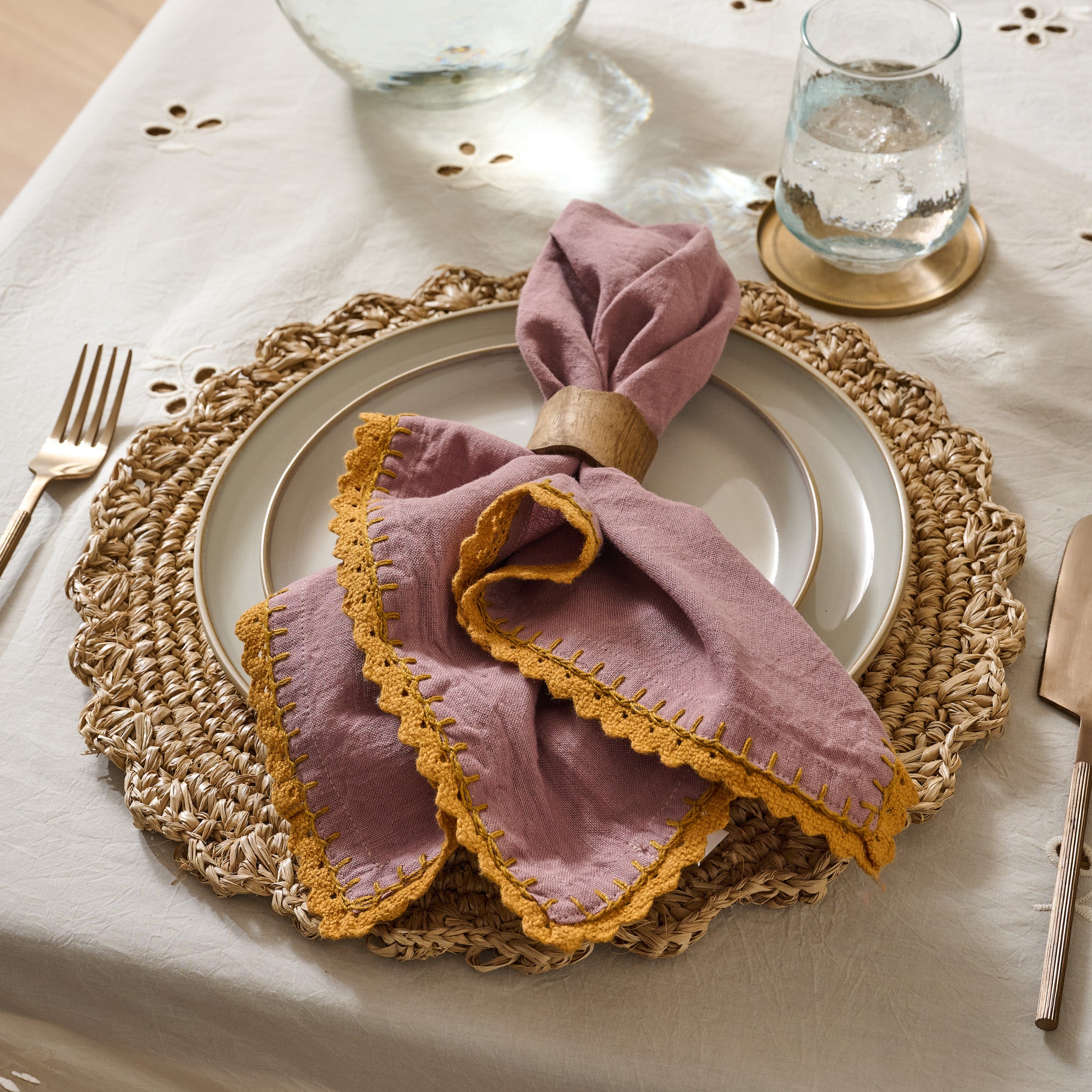 Lavender Crochet Edge Napkin folded on plate with napkin ring $40.00