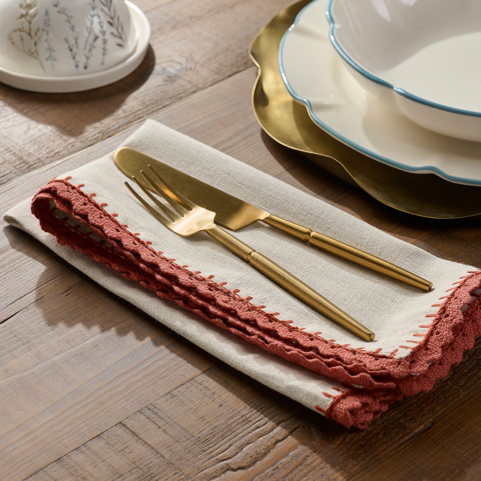 Apricot Crochet Edge Napkin Set of Four shown on table $44.00