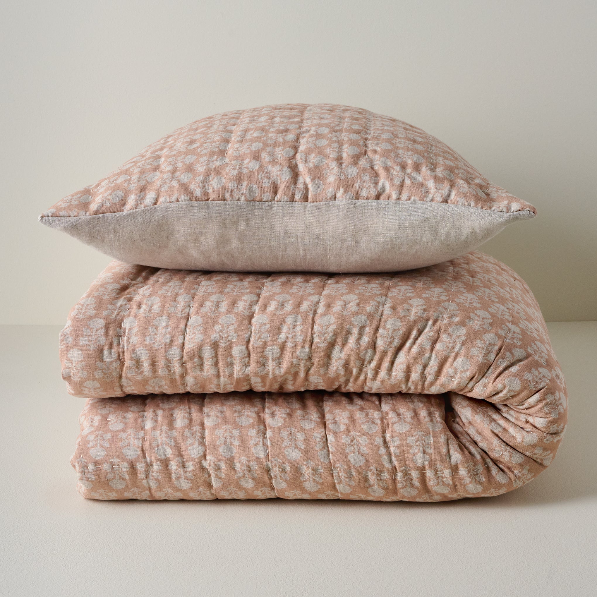 Ellie Block Print Quilt shown stacked with coordinating sham