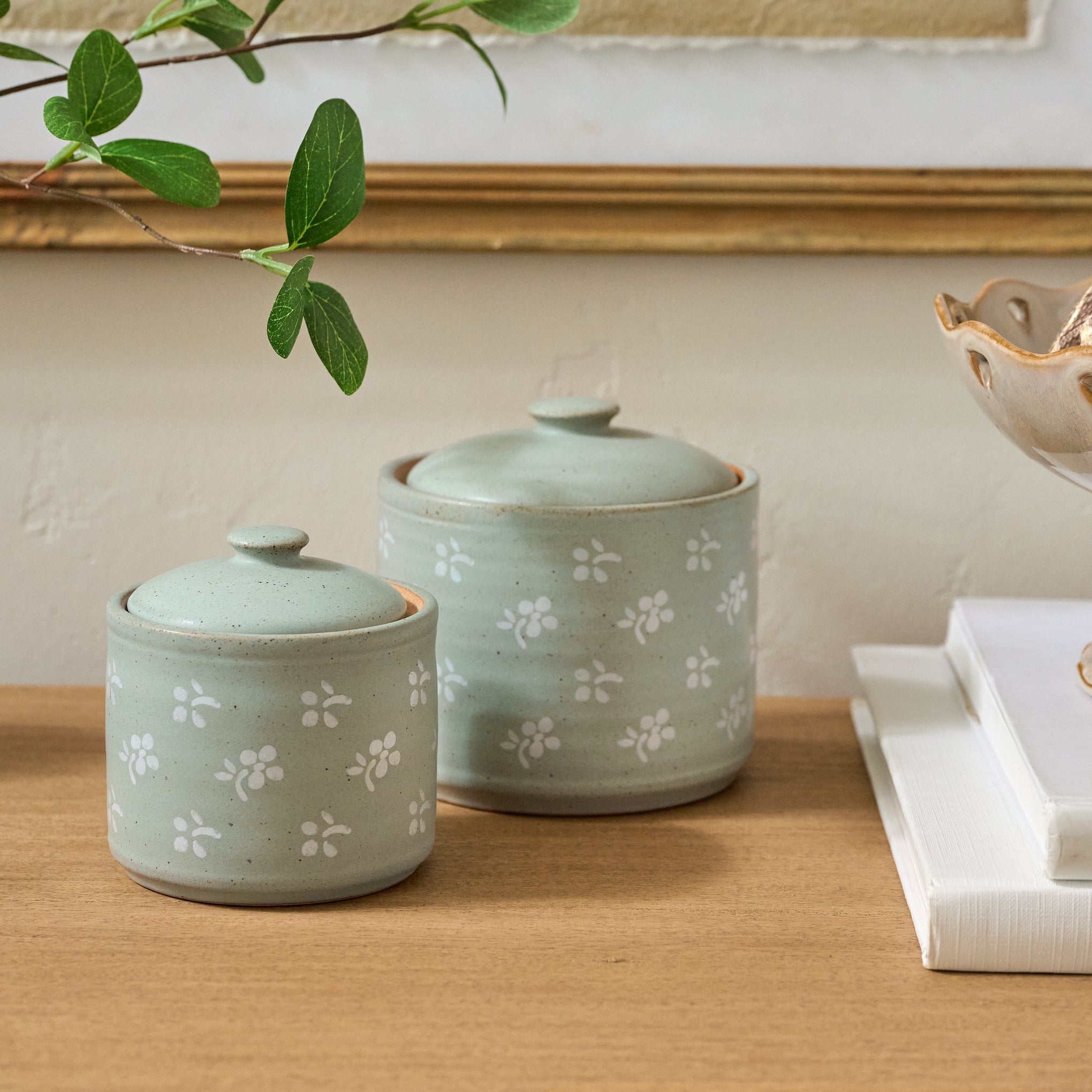 Emilie Floral Painted Canisters shown on table On sale with items ranging from $11.20 to $14.40, discounted from $14.00 to $18.00