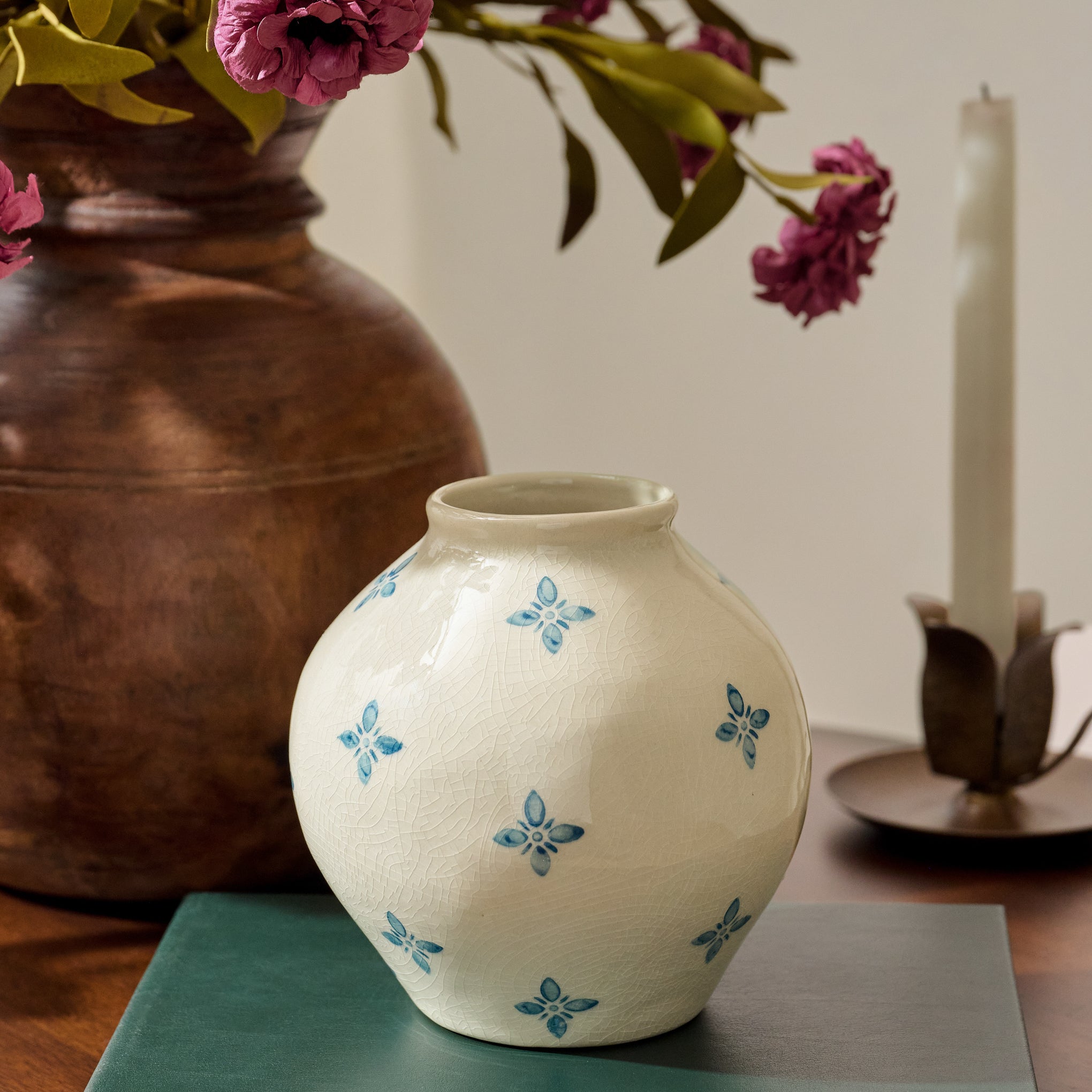 Cream and Blue Luna Bud Vase shown on nightstand $18.00