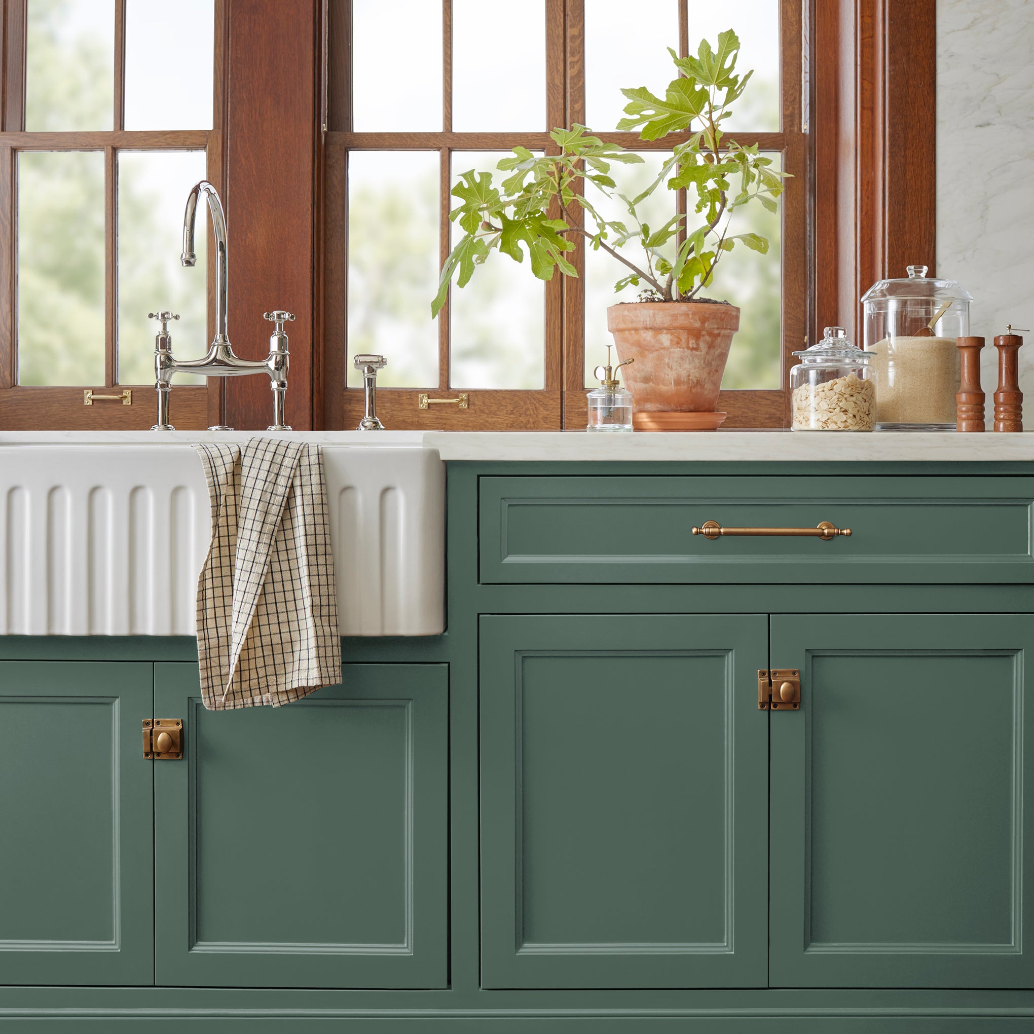 Deep hunter green comparable to pine tree leaves door and cabinet paint named regal leaf shown painted on kitchen cabinet  