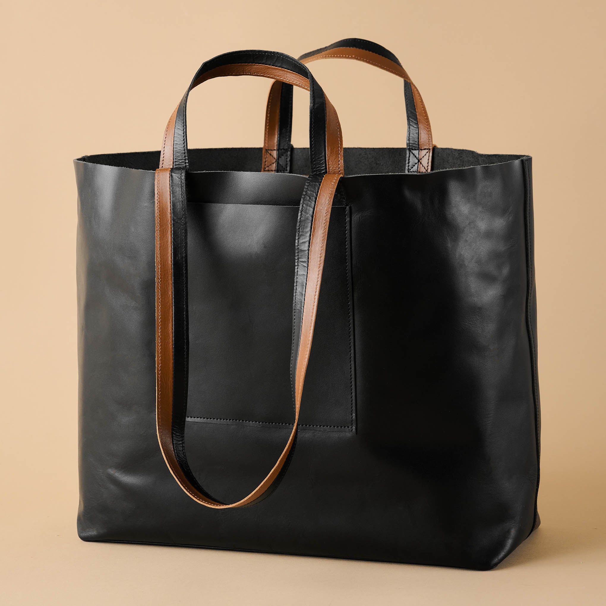 Magnolia Essential Black Tote On sale for $159.99, discounted from $268.00