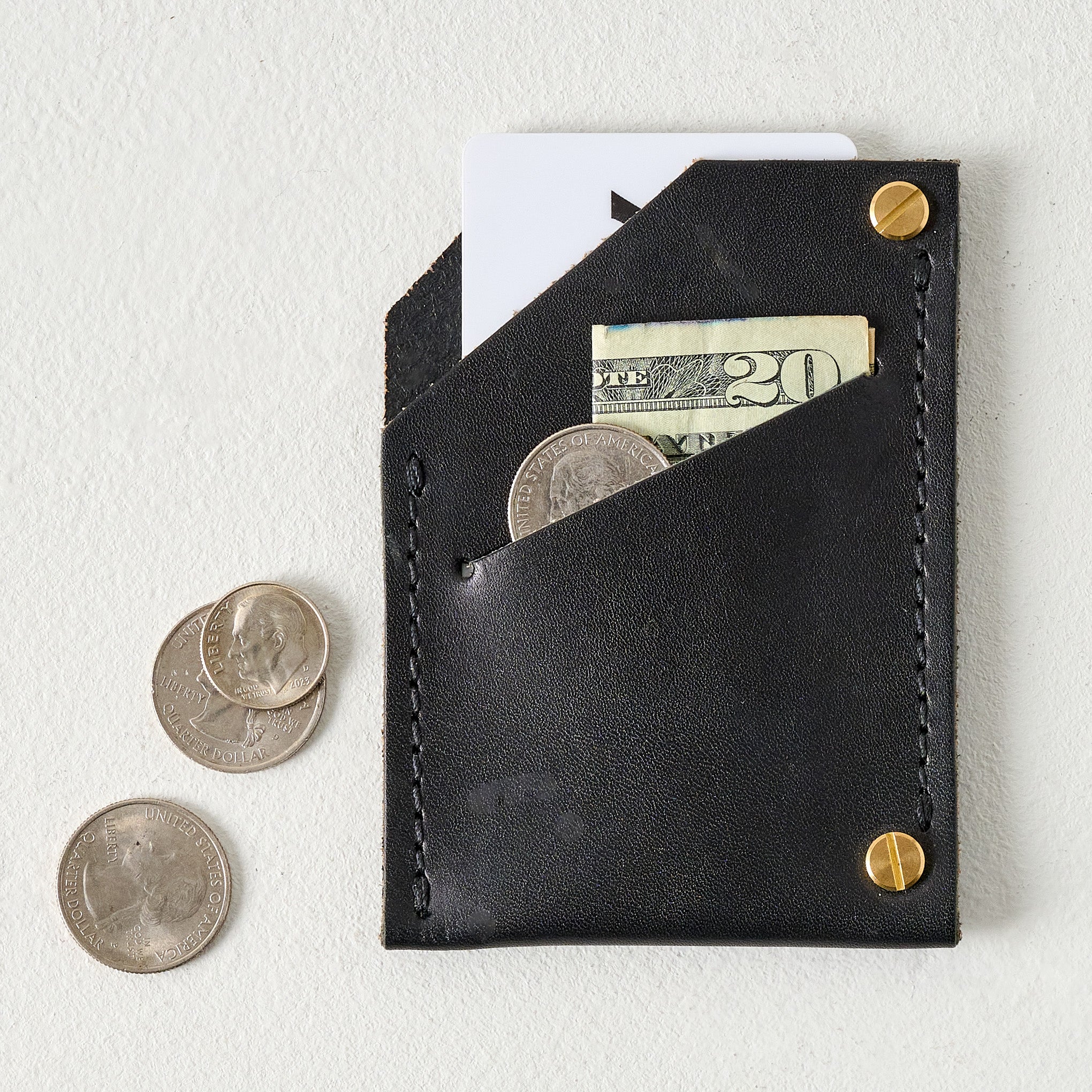 Black Quebec Wallet shown holding money and card