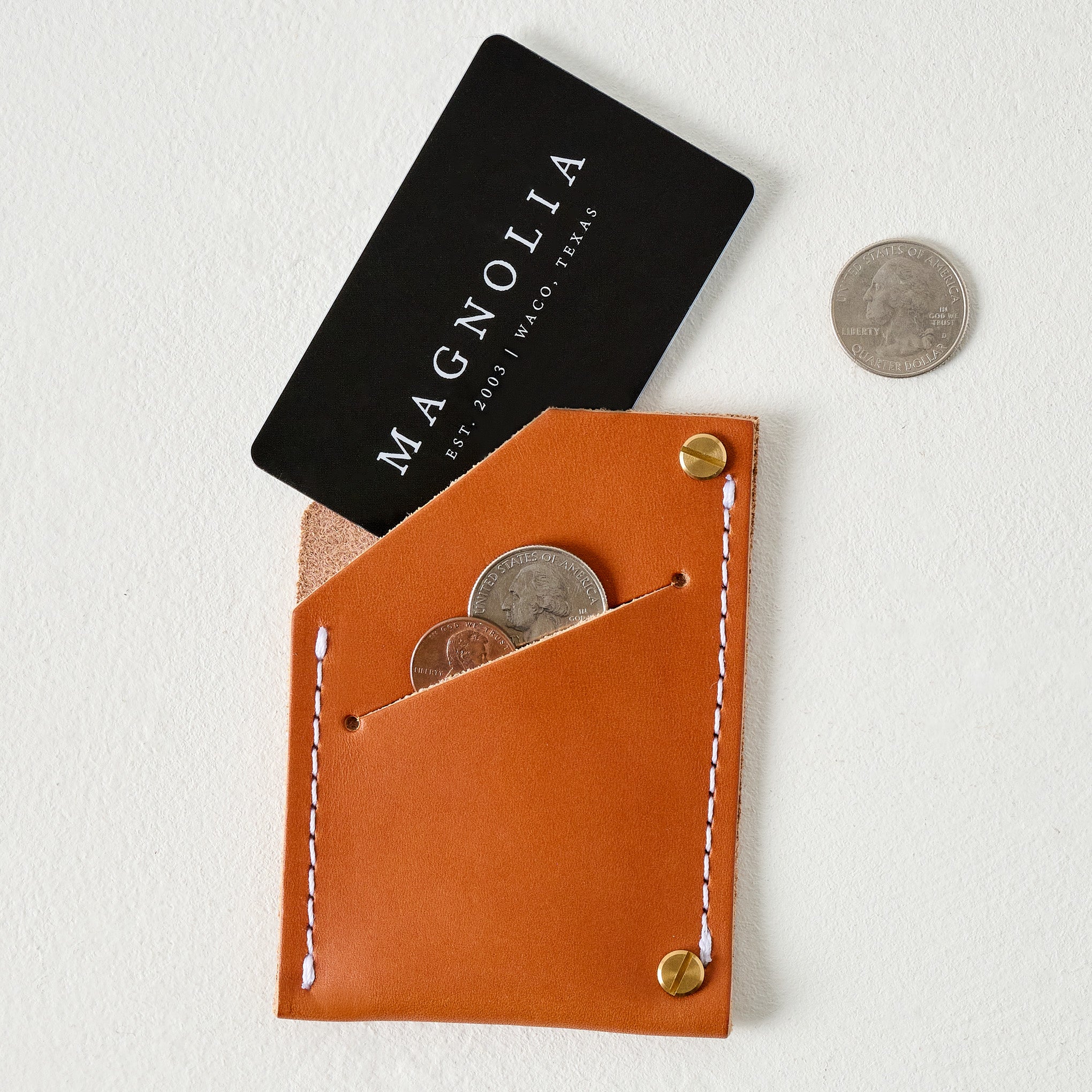 Brown Quebec Wallet shown holding money and card