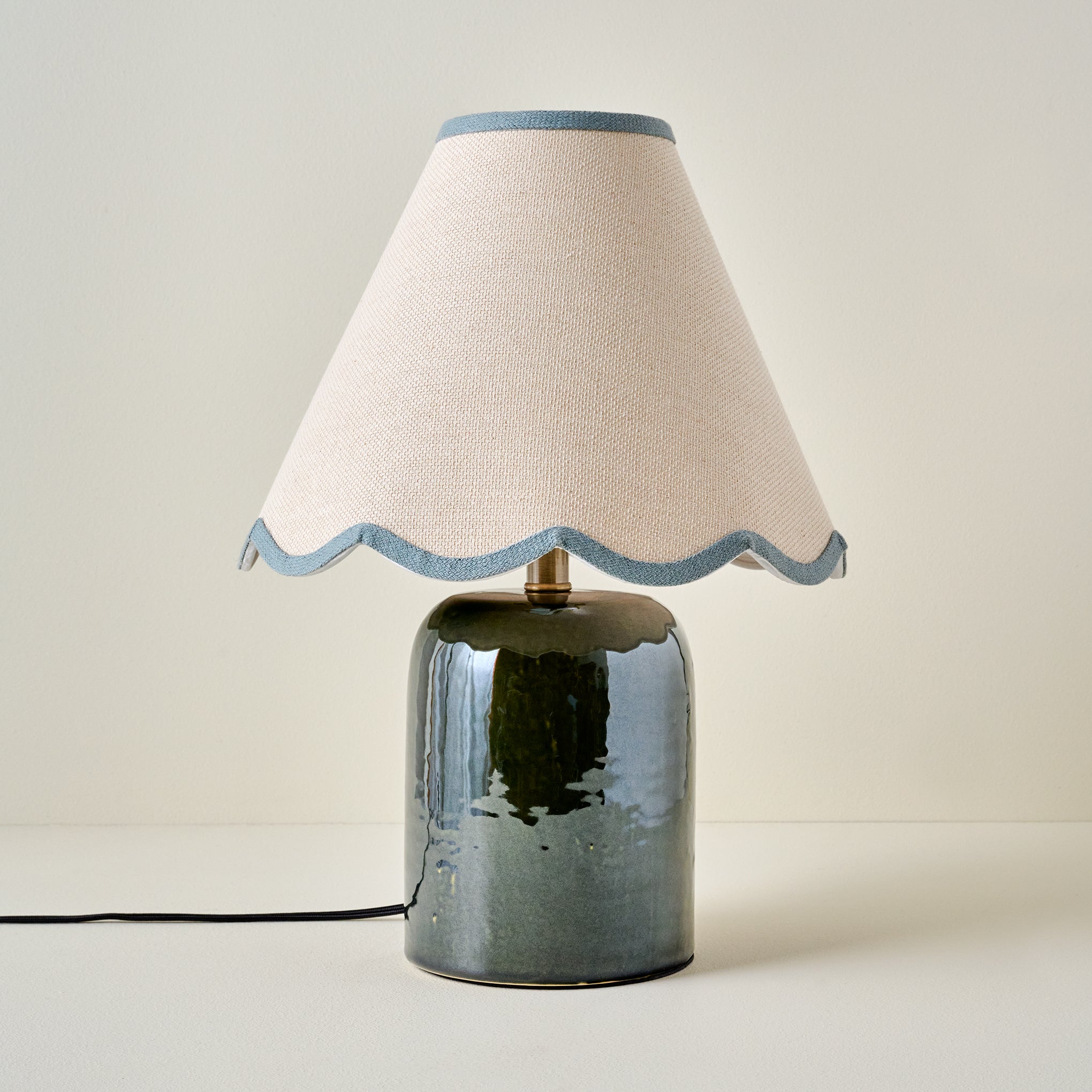 Farrah Table Lamp - Textured Green shown with blue wavy lamp shade