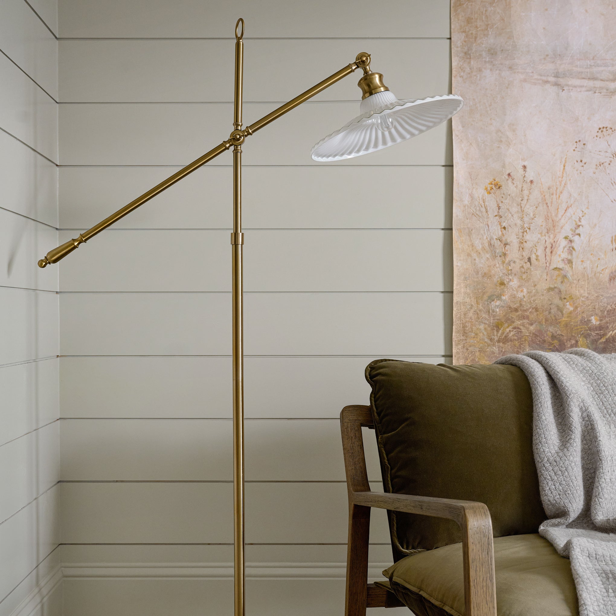 Marjorie Milk Glass Floor Lamp shown in corner of room over chair $248.00