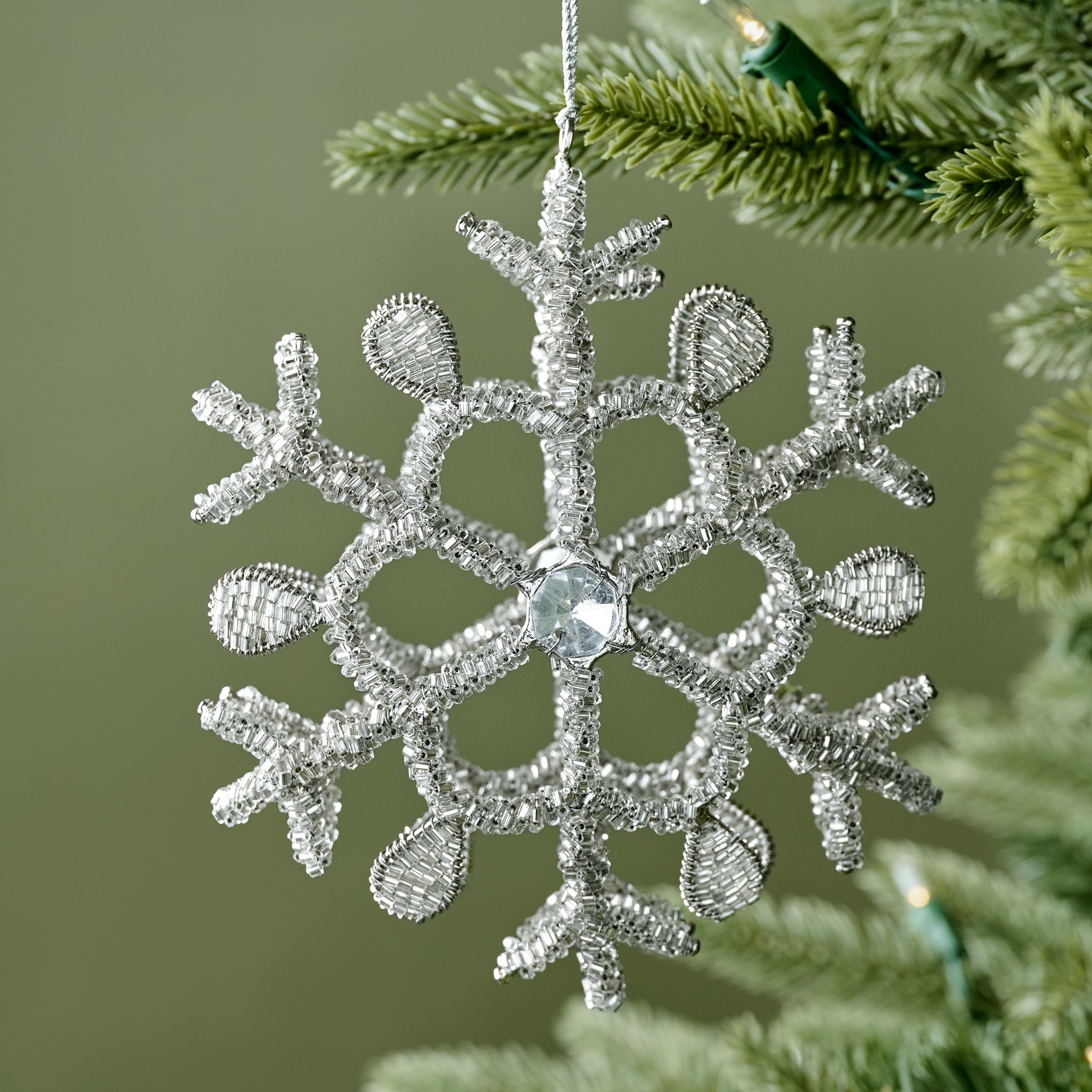 Glass Beaded Snowflake Ornament shown on tree On sale for $8.49, discounted from $24.00