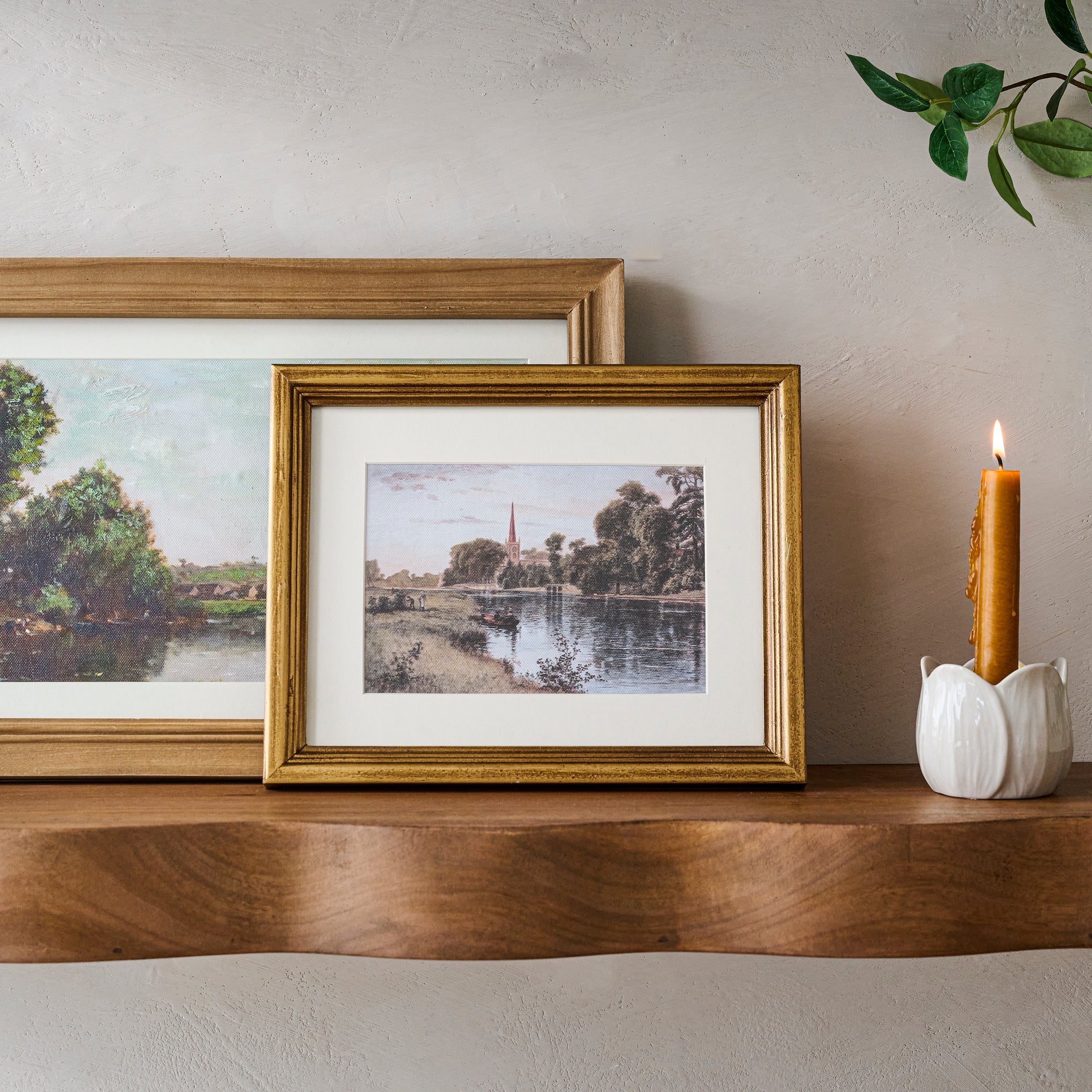 Vintage Steeple View in front of another landscape art and next to a taper holder $32.00