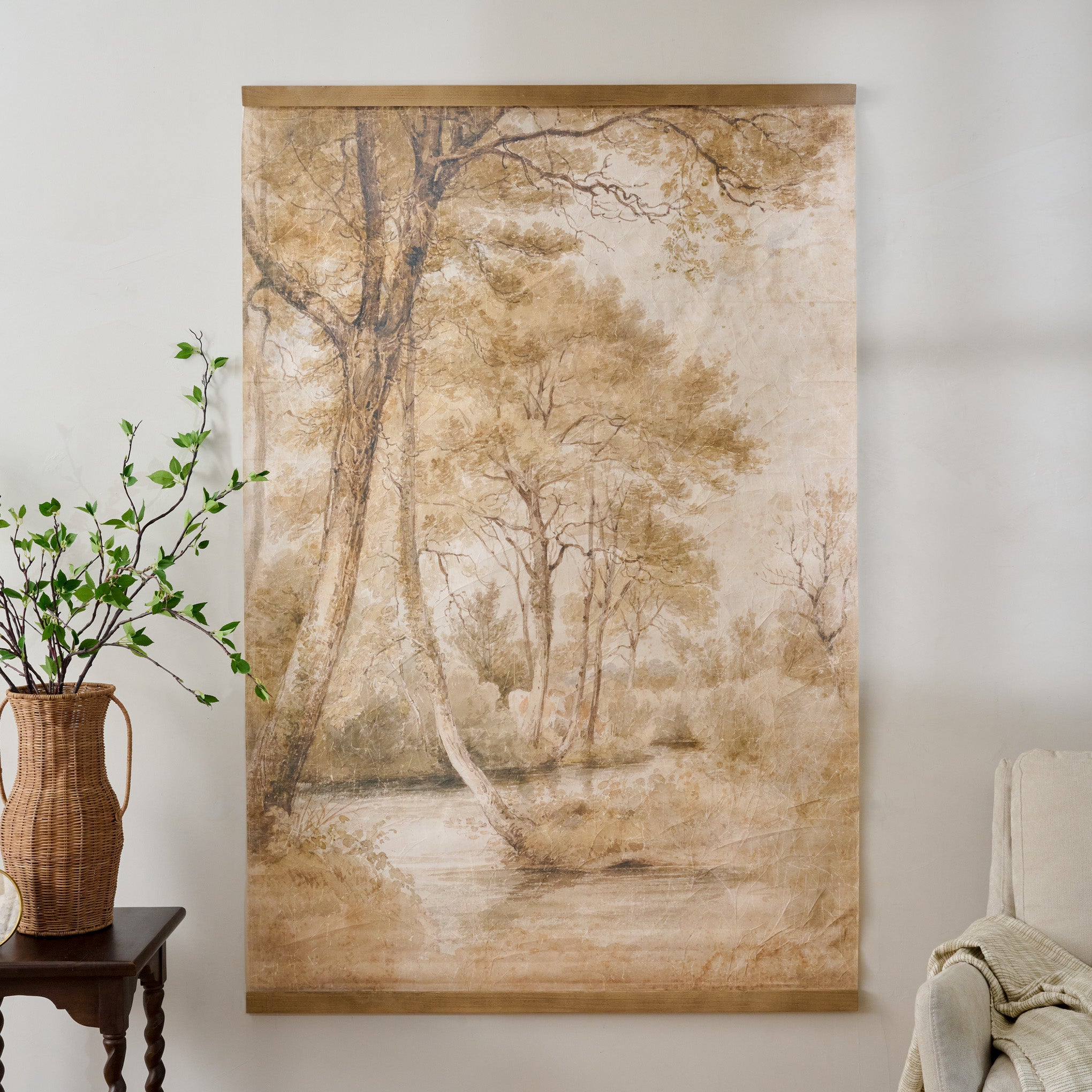 Oversized Folklore Forest Tapestry shown hung on wall by furniture