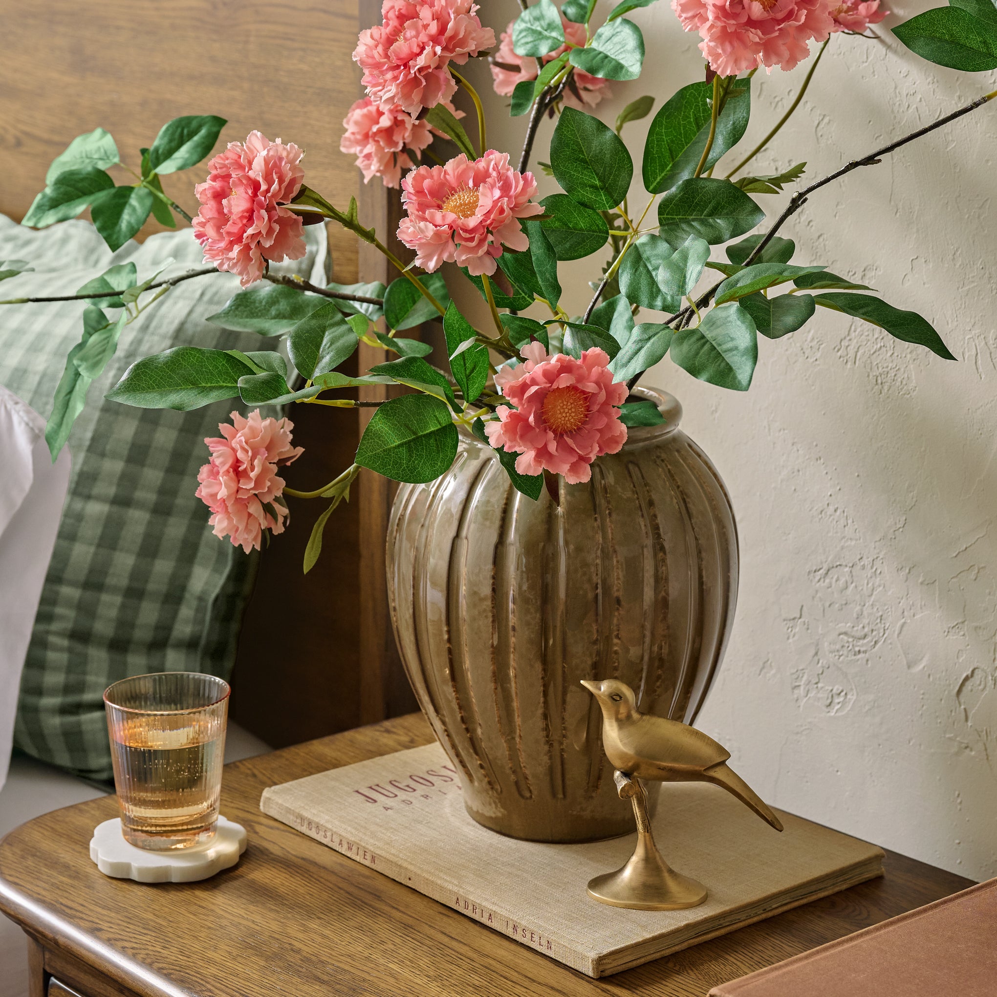 Callum Ribbed Vase shown on nightstand with florals Items range from $36.00 to $64.00