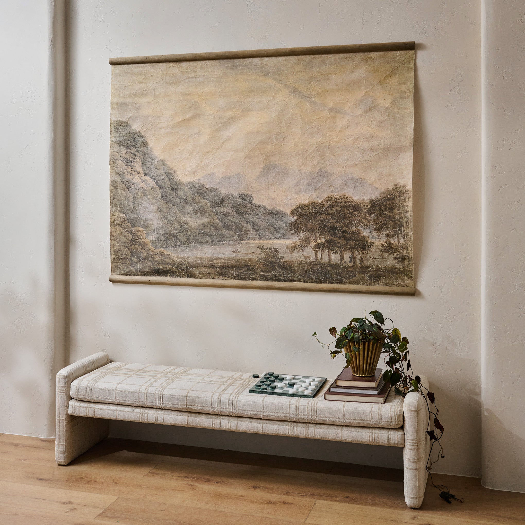 Oversized On the Banks Tapestry shown hung above bench