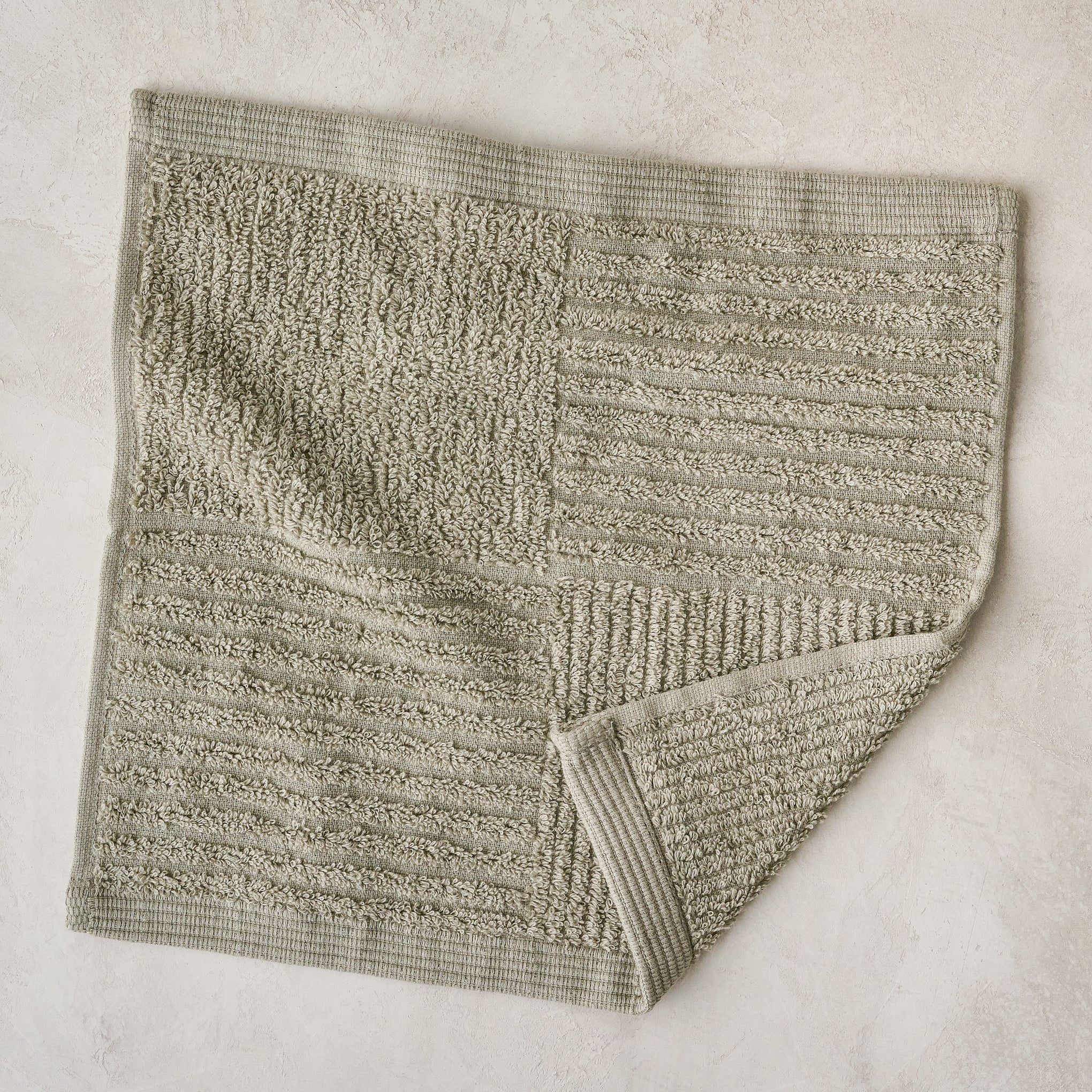 folded eucalyptus green textured bath washcloth