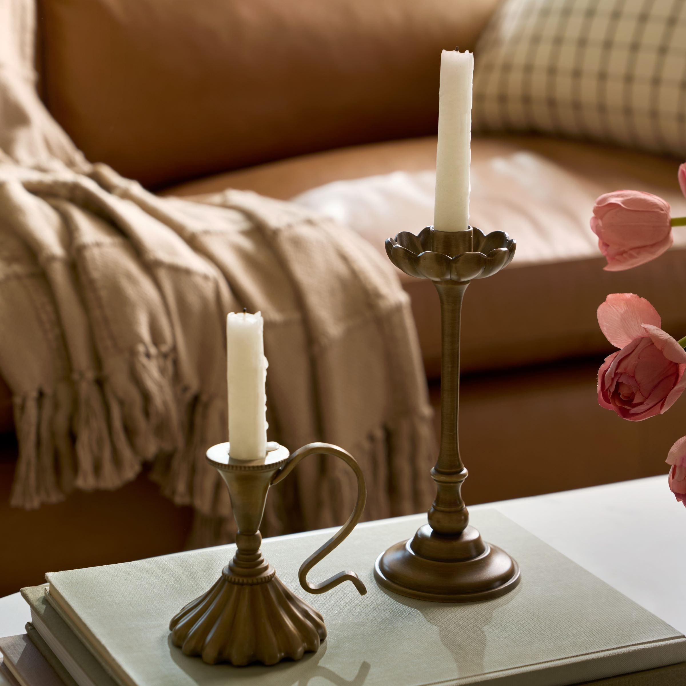 Anna Antique Brass Taper Holders set on coffee table Items range from $20.00 to $28.00