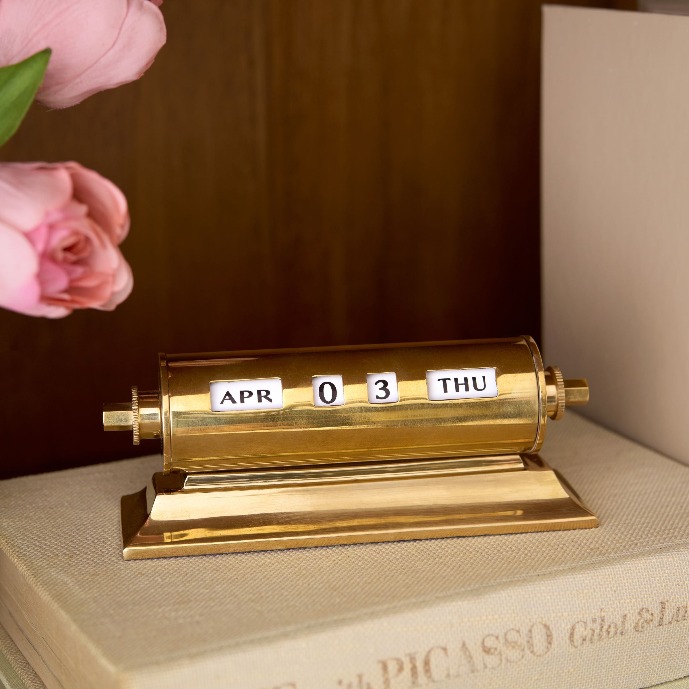 Vintage Inspired Brass Perpetual Calendar set on bookshelf