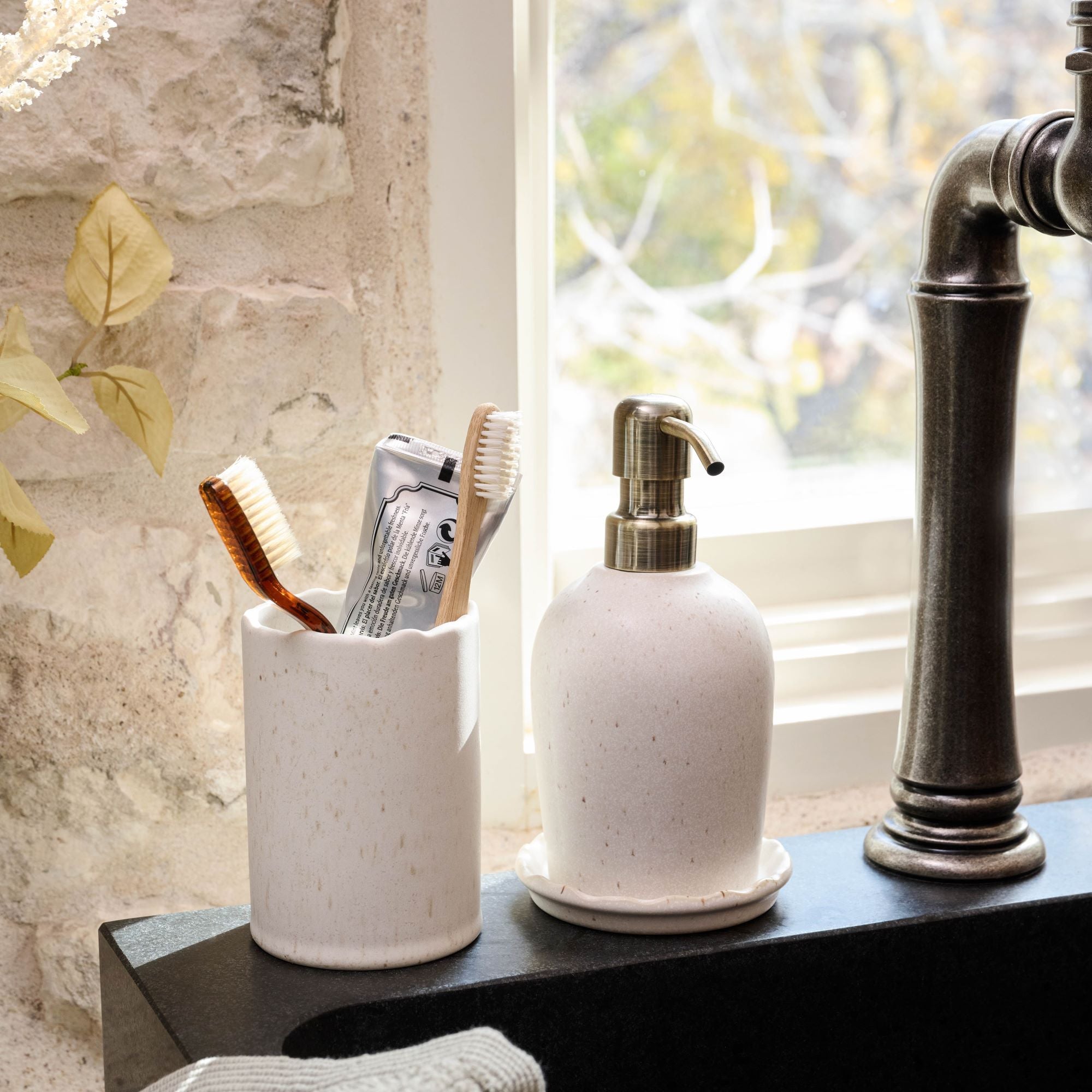 Faye Ceramic Container with toothbrushes on bathroom sink On sale for $14.99, discounted from $22.00