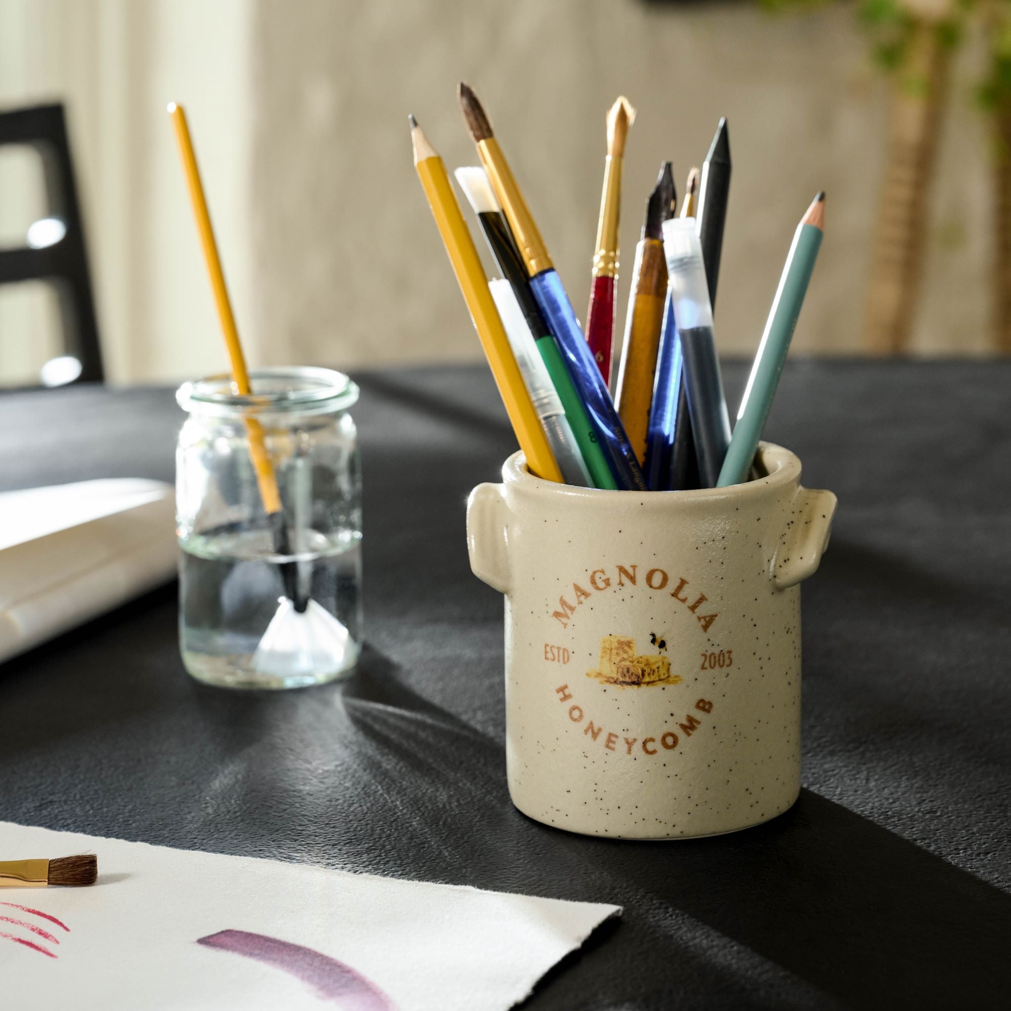Magnolia Honeycomb Candle emptied and used as paintbrush holder $24.00