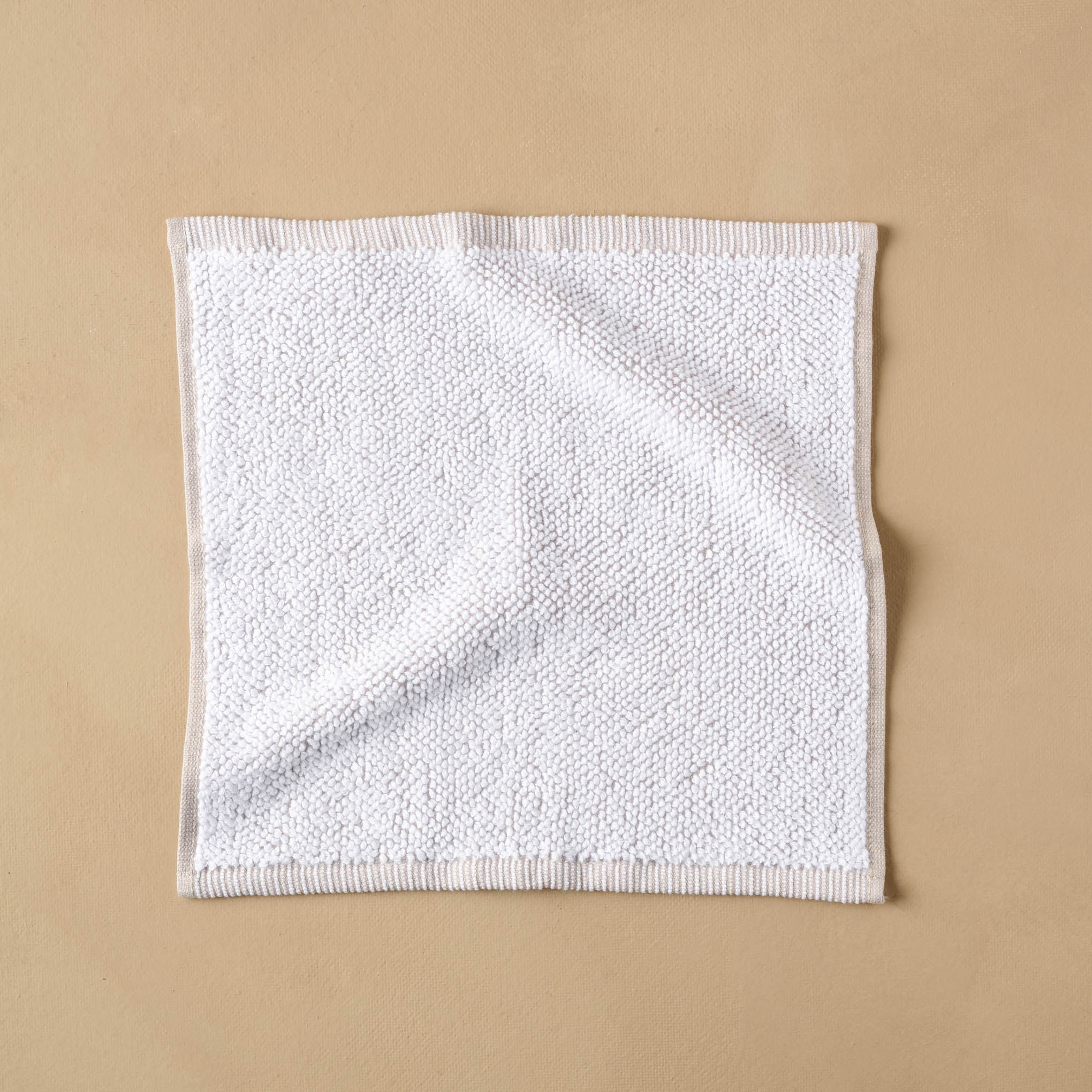 Linen Assisi Textured Towel in wash cloth size. 