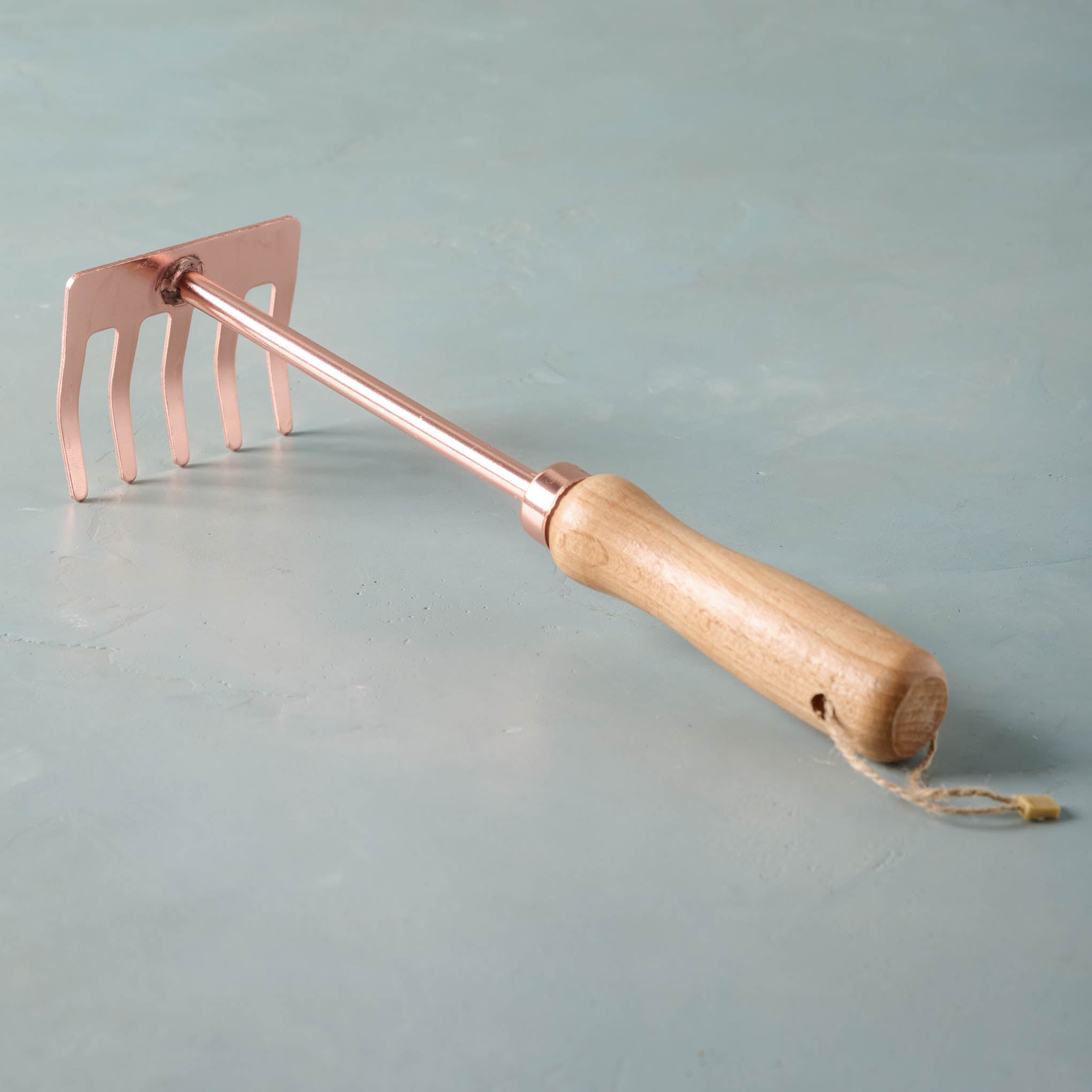 Copper rake with wooden handle On sale for $6.99, discounted from $16.00