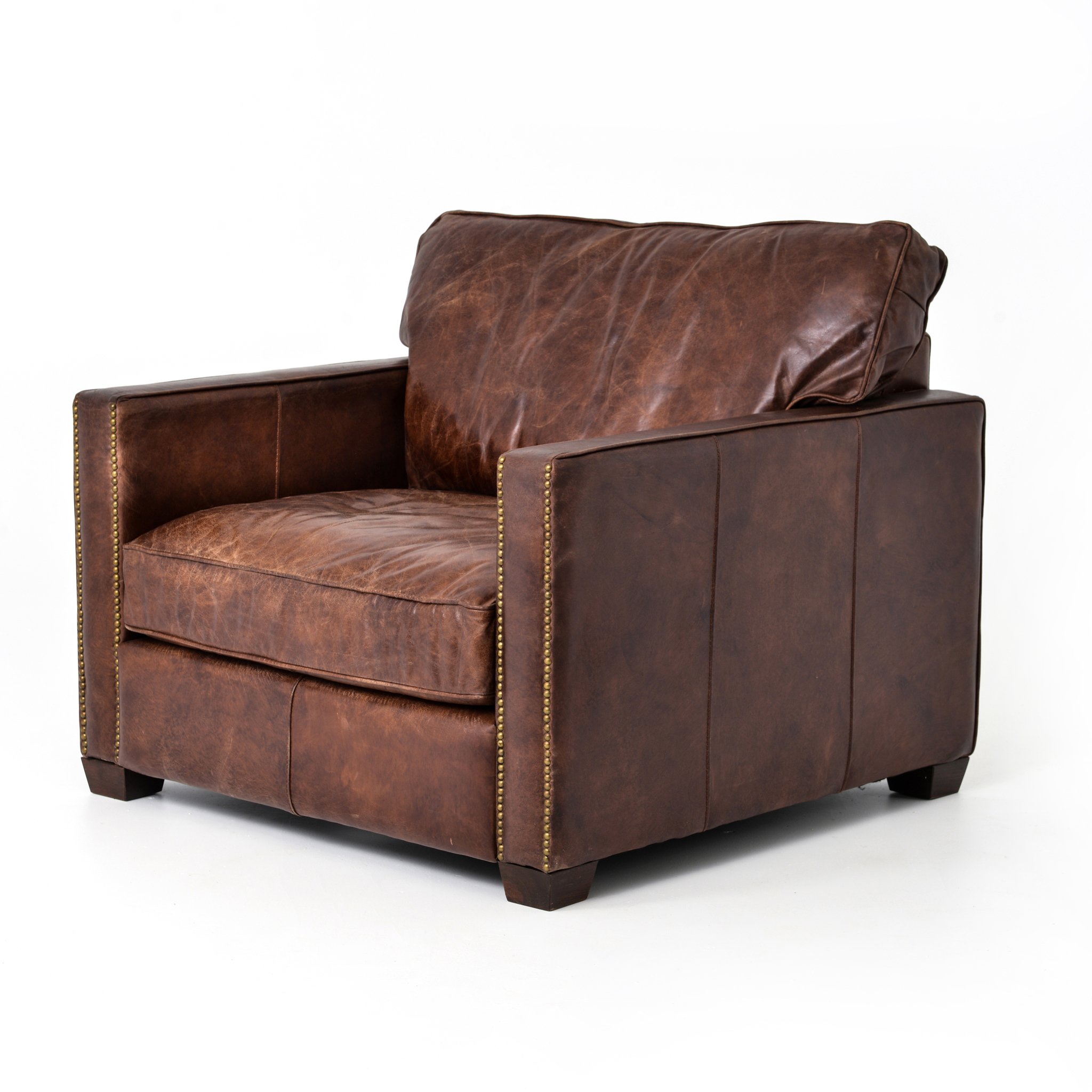 medium brown leather arm chair with nailhead arms $2999.00
