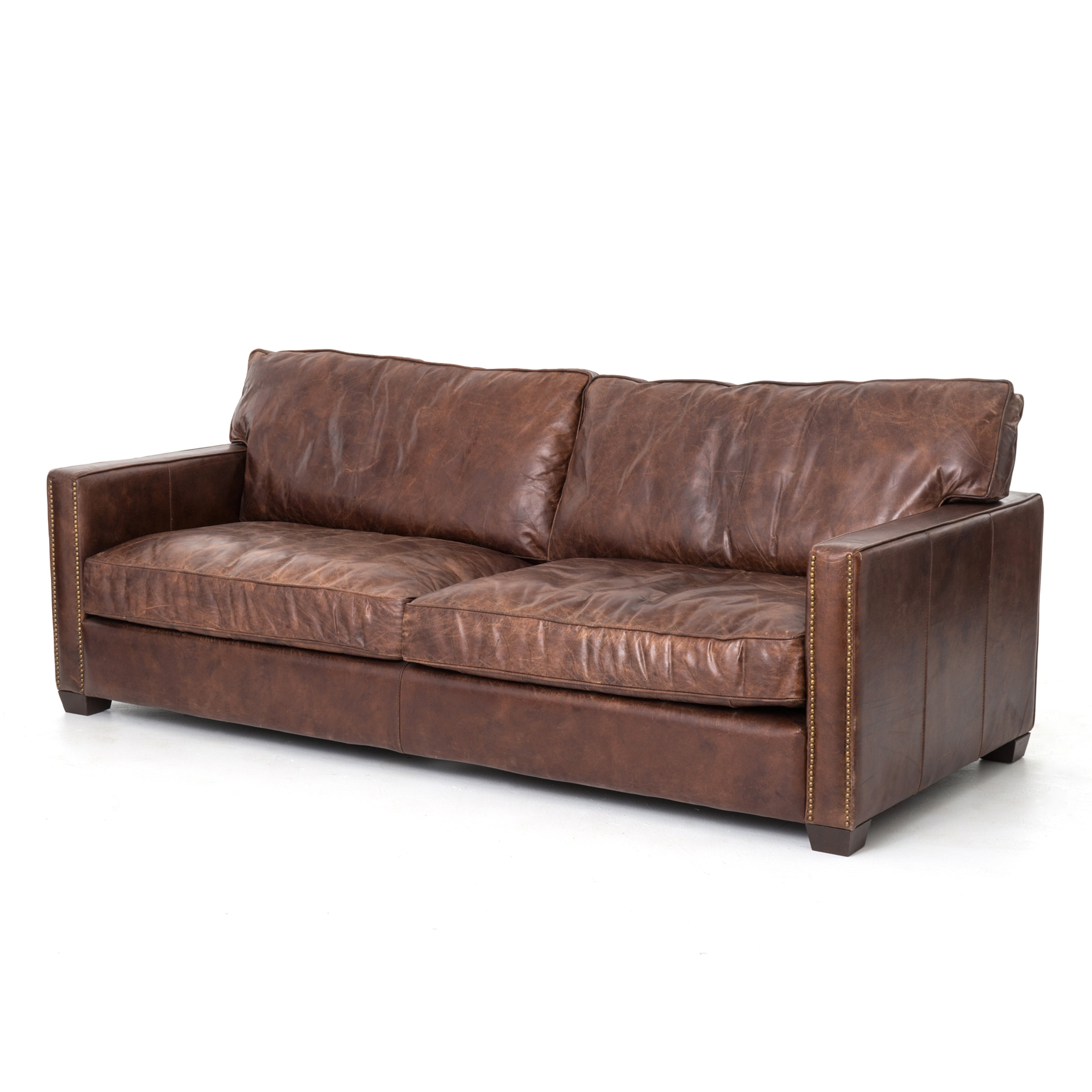 medium brown leather sofa with nailhead arms Items range from $3699.00 to $5199.00