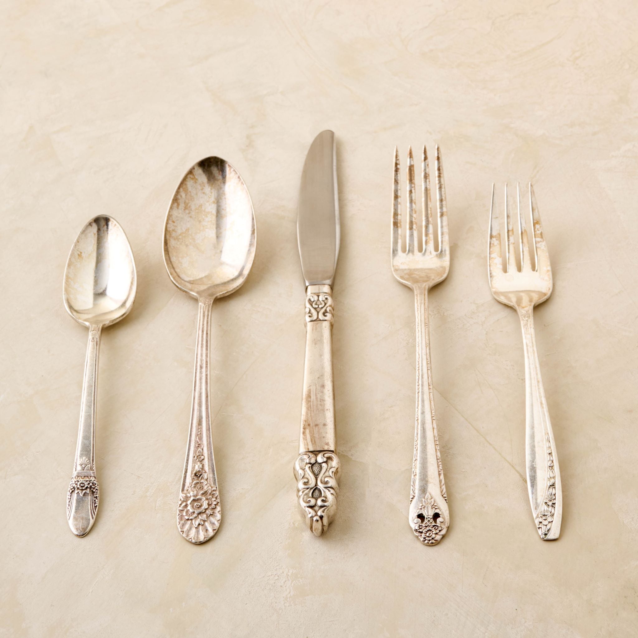 magnolia vintage flatware set including fork, knife, and spoon $40.00