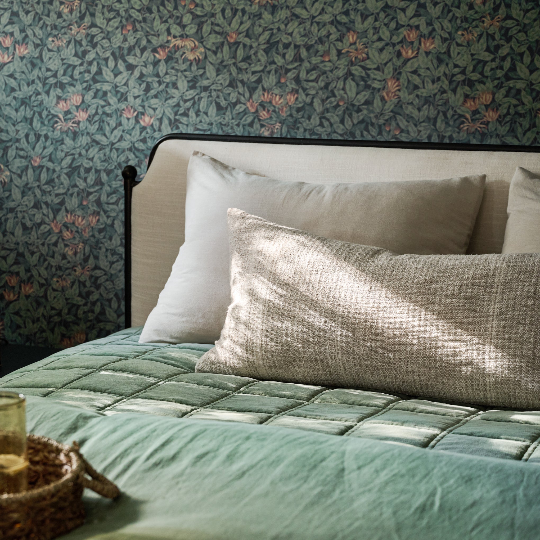 Weekend Velvet Quilt - Dusty Green on bed with tan pillows