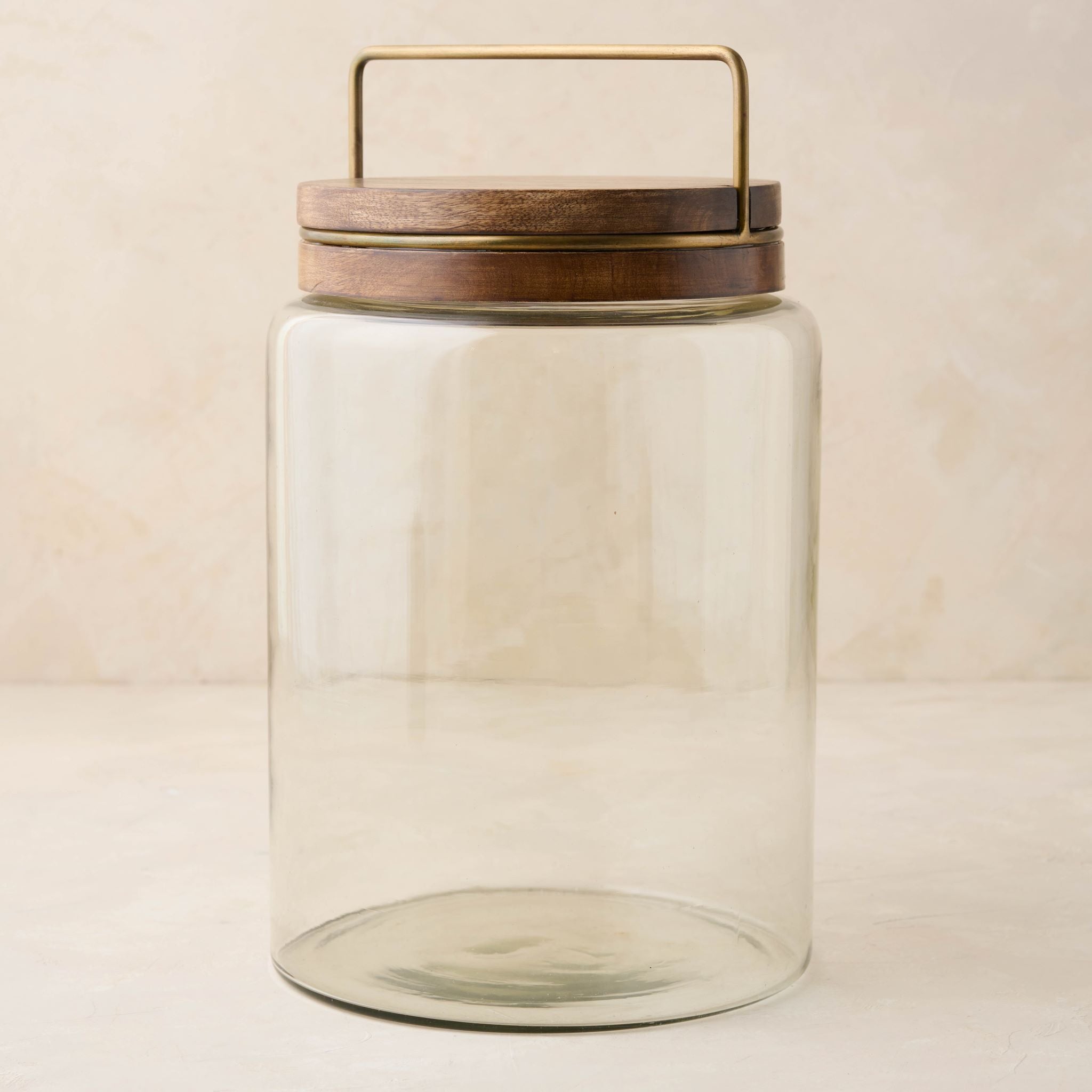 magnolia glass canister with wood and antique brass lid