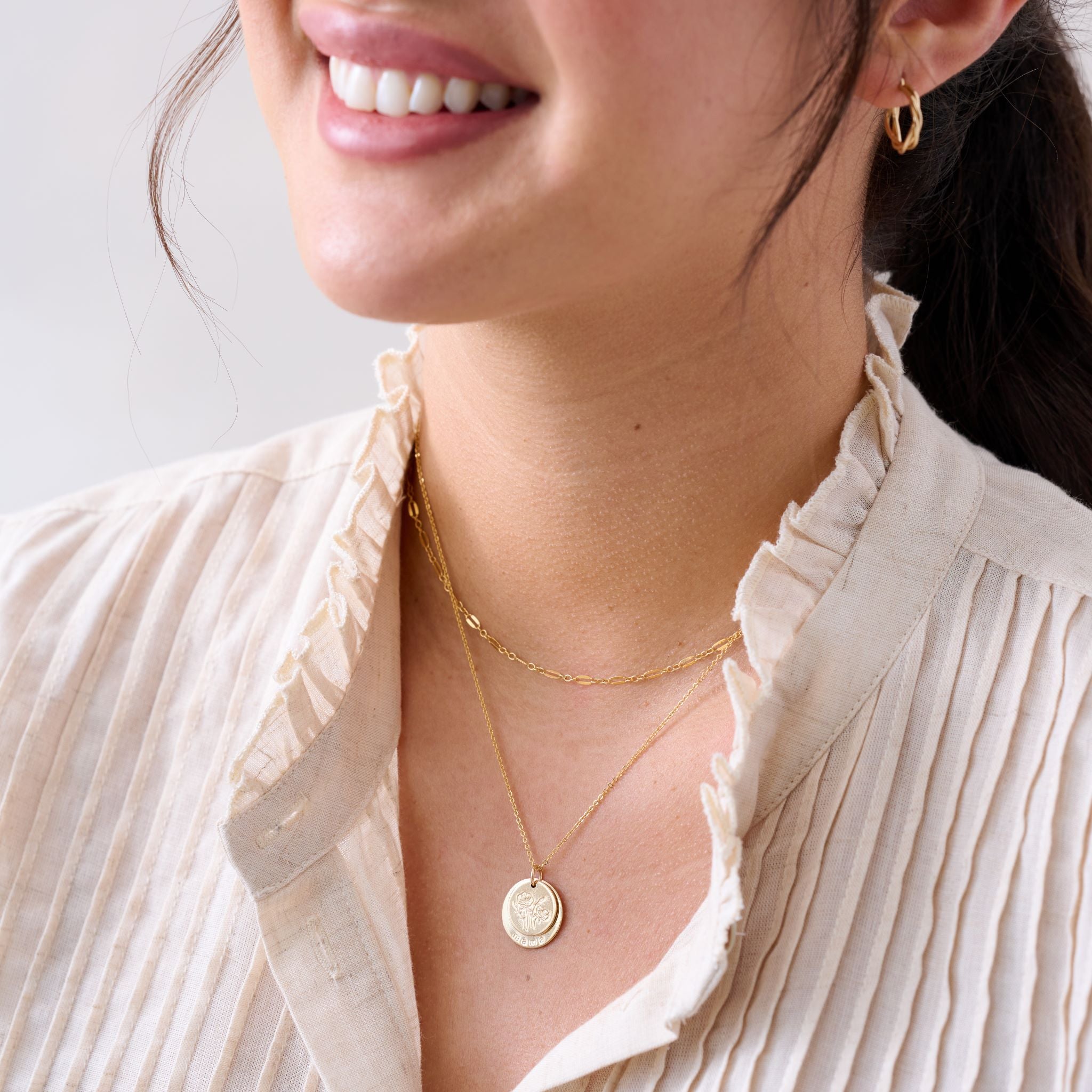 gold disc necklace with engraved flowers and mama $84.00