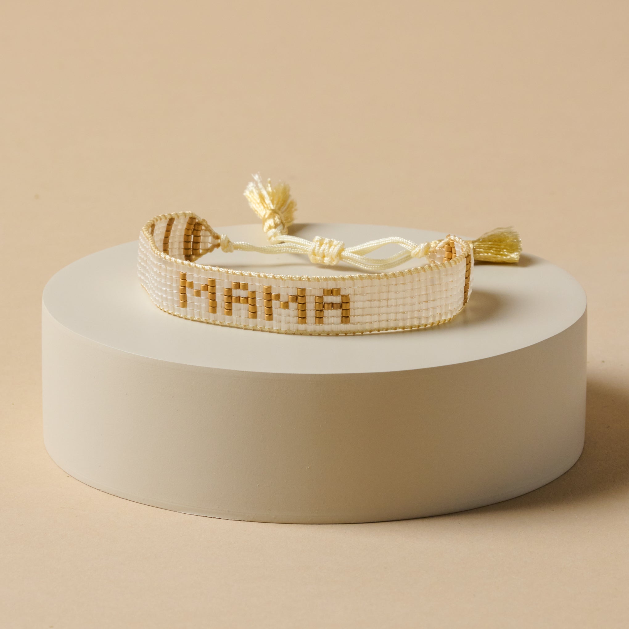 White and gold mama beaded bracelet  $60.00