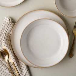 Stone White Lakelynn Pasta Bowl top view of bowl on top of a dinner plate