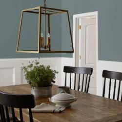 deep muted blue with grey undertones paint named duke gray shown painted on dining room wall