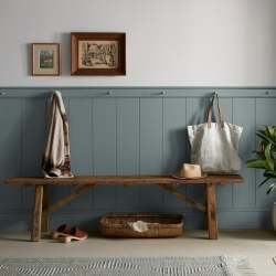 deep muted blue with grey undertones paint named duke gray shown painted on entryway wall