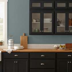 deep muted blue with grey undertones paint named duke gray shown painted on kitchen wall