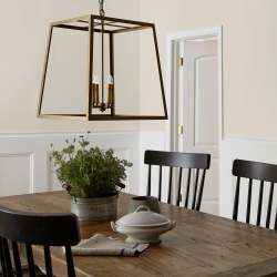 Warm beige interior paint named blanched shown painted on dining room wall