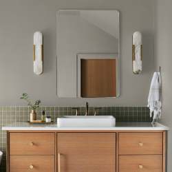 Warm chalky pale green interior paint named flower jar shown painted on bathroom wall