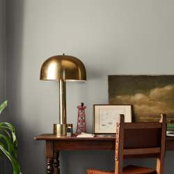 Warm chalky pale green interior paint named flower jar shown painted on bedroom wall