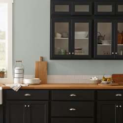 Frosty mint green with beige notes interior paint named early riser shown painted on kitchen wall