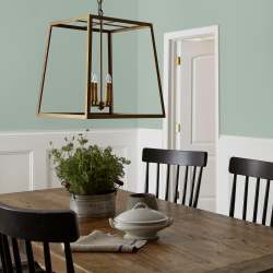 Creamy mint green interior paint named freshly cut stems shown painted on dining room wall