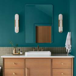 A deep peacock blue interior paint named under the stars shown painted on bathroom wall