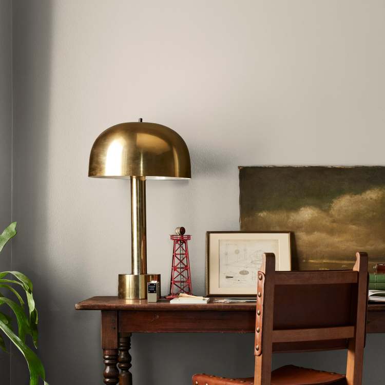 medium grey with tan interior paint named gatherings shown painted on bedroom wall