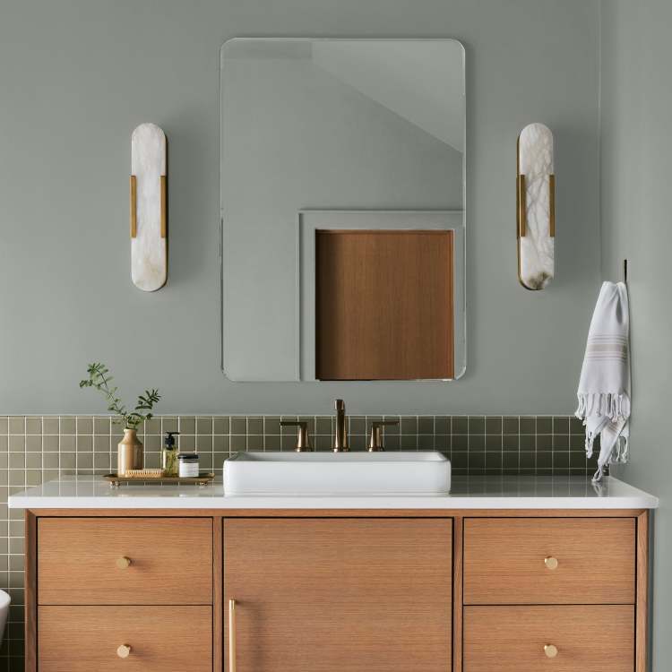 Frosty mint green with beige notes interior paint named early riser shown painted on bathroom wall