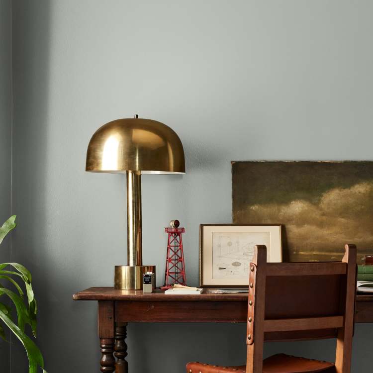 Frosty mint green with beige notes interior paint named early riser shown painted on bedroom wall