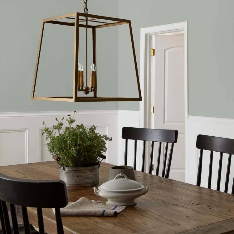 Frosty mint green with beige notes interior paint named early riser shown painted on dining room wall