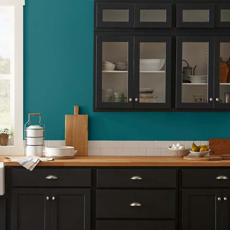 A deep peacock blue interior paint named under the stars shown painted on kitchen wall